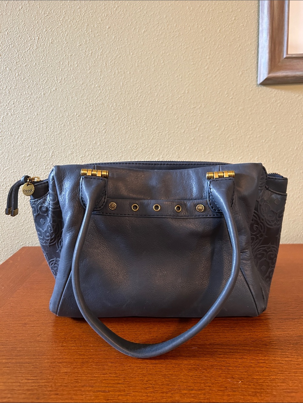 The Sak Serenaโ Handbag Navy Blue Floral Embossed Leather Design